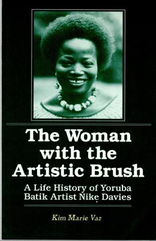 Cover of the book The Woman with the Artistic Brush: A Life History of Yoruba Batik Artist Nike Davies by Kim Marie Vaz, M.E.Sharpe