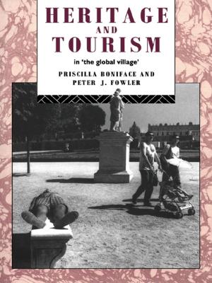 Cover of the book Heritage and Tourism in The Global Village by Liam Clarke