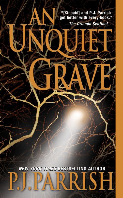 Cover of the book An Unquiet Grave by P.J. Parrish, Pinnacle Books