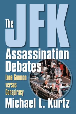 Cover of the book The JFK Assassination Debates by Phillip Cooper