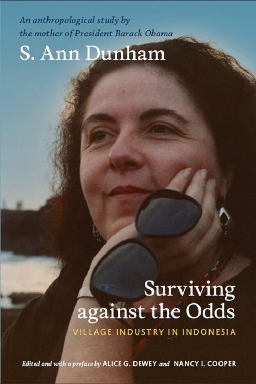 Cover of the book Surviving against the Odds by S. Ann Dunham, Nancy I. Cooper, Robert W. Hefner, Duke University Press