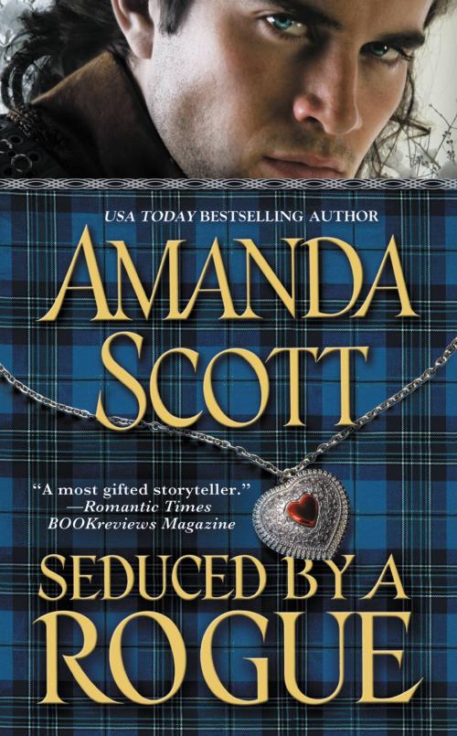 Cover of the book Seduced by a Rogue by Amanda Scott, Grand Central Publishing
