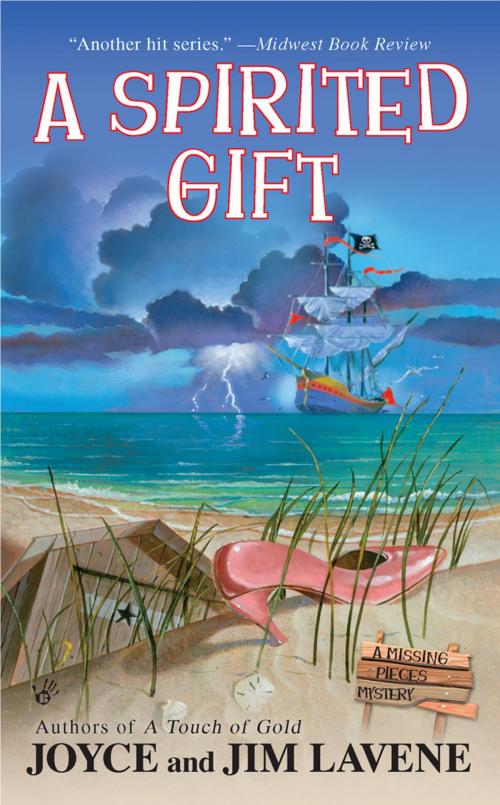 Cover of the book A Spirited Gift by Joyce and Jim Lavene, Penguin Publishing Group