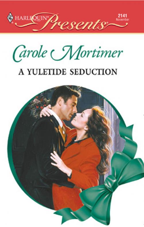Cover of the book A Yuletide Seduction by Carole Mortimer, Harlequin