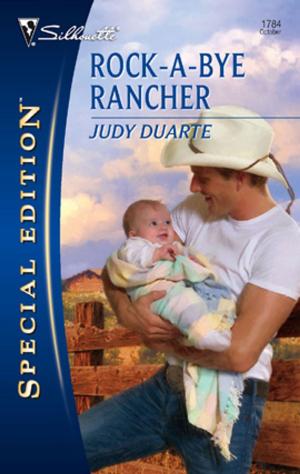 Cover of the book Rock-A-Bye Rancher by Susan Crosby