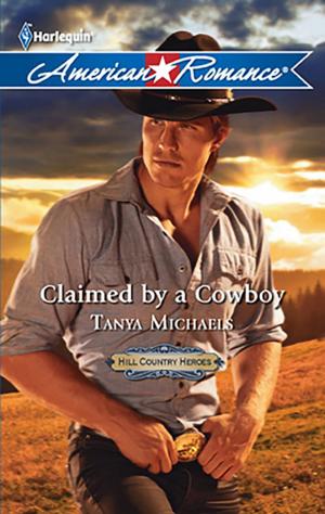 bigCover of the book Claimed by a Cowboy by 