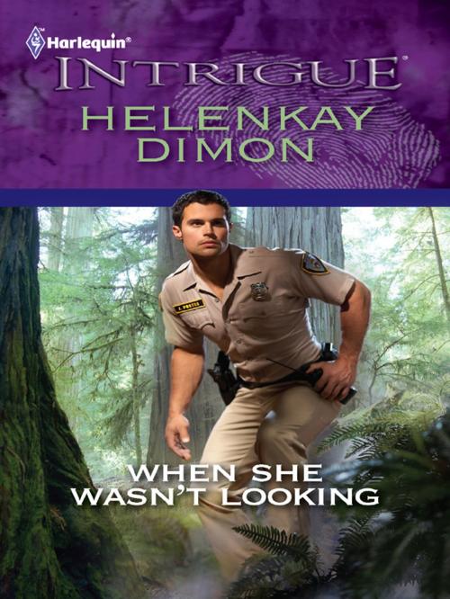 Cover of the book When She Wasn't Looking by HelenKay Dimon, Harlequin