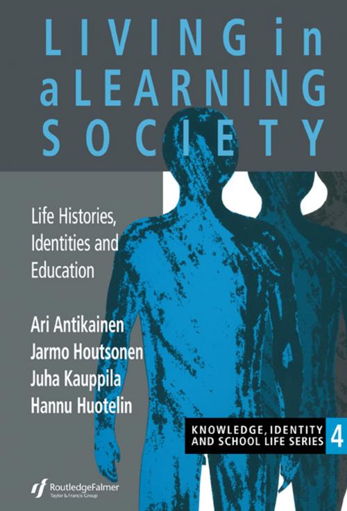 Cover of the book Living In A Learning Society by Ari Antikainen, Jarmo Houtsonen, Juha Kauppila, Hannu Huotelin, Taylor and Francis