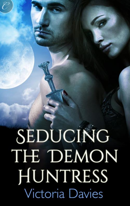 Cover of the book Seducing the Demon Huntress by Victoria Davies, Carina Press