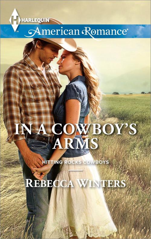 Cover of the book In a Cowboy's Arms by Rebecca Winters, Harlequin