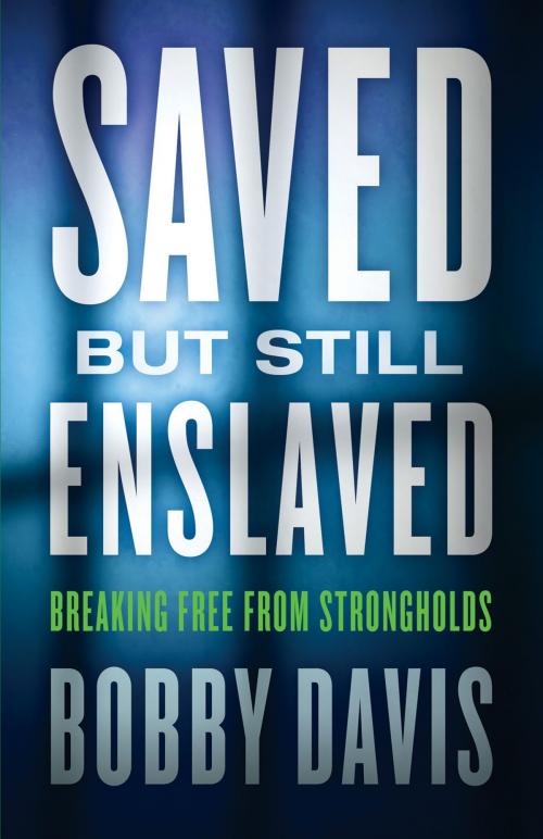 Cover of the book Saved but Still Enslaved by Bobby Davis, Baker Publishing Group