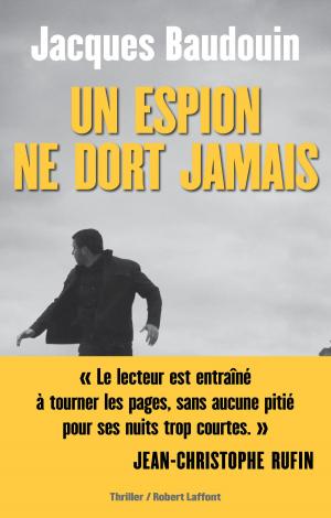 Cover of Un Espion ne dort jamais by Jacques BAUDOUIN, Groupe Robert Laffont