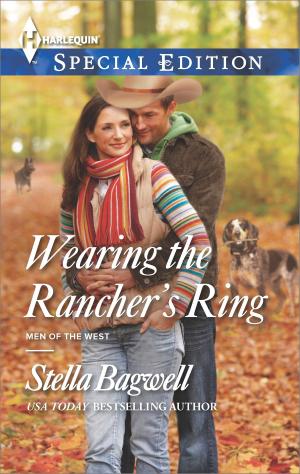 Cover of the book Wearing the Rancher's Ring by Debra Webb