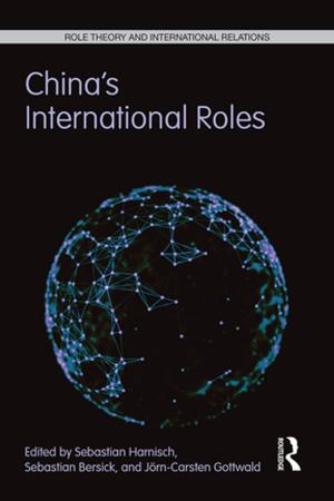 Cover of the book China's International Roles by Peter Lee-Wright, Angela Phillips, Tamara Witschge