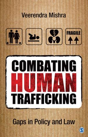 Cover of the book Combating Human Trafficking by Mike Abrams