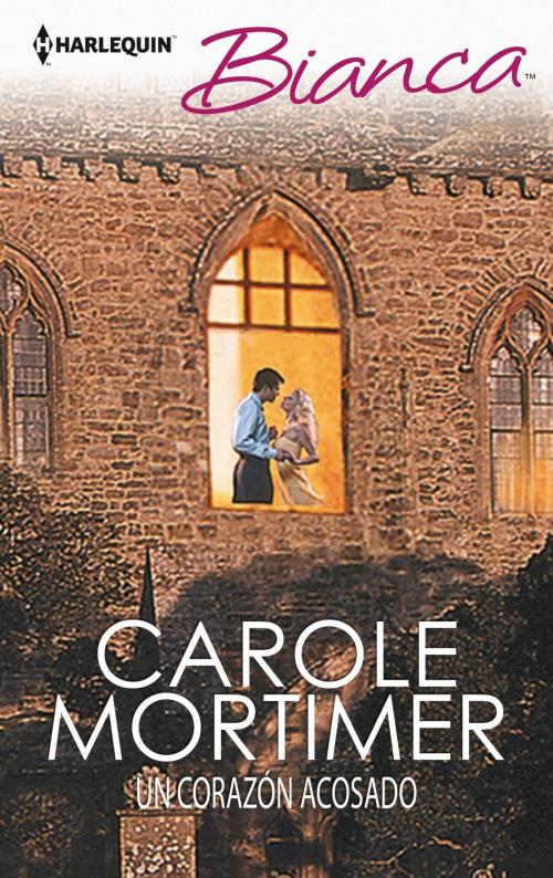 Cover of the book Un corazón acosado by Carole Mortimer, Harlequin, una división de HarperCollins Ibérica, S.A.