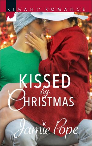 Cover of the book Kissed by Christmas by April Arrington