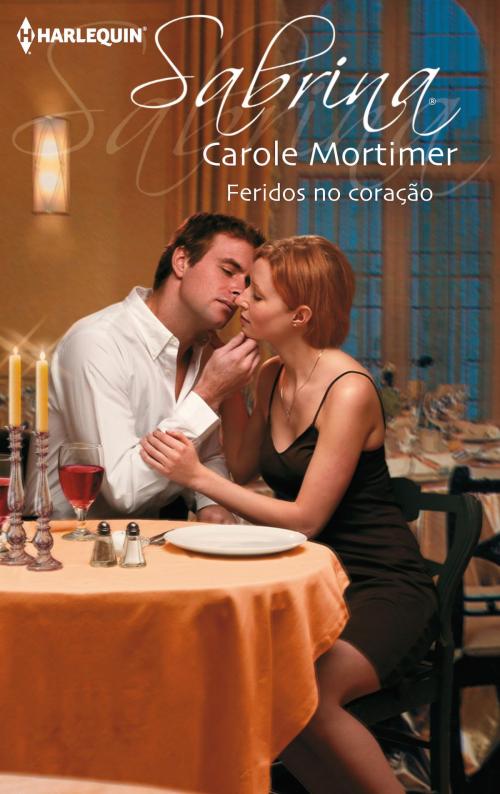 Cover of the book Feridos no coração by Carole Mortimer, Harlequin, uma divisão de HarperCollins Ibérica, S.A.