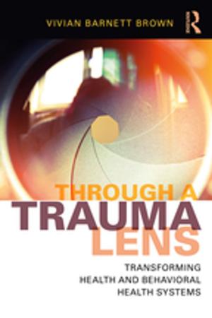 Cover of the book Through a Trauma Lens by Jennie George, Margaret Hunt