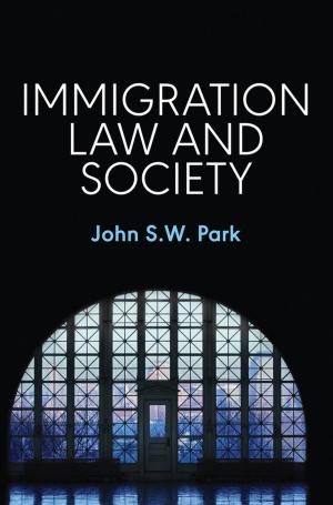 Book cover of Immigration Law and Society