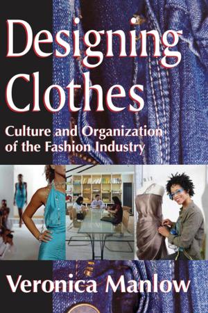 Cover of the book Designing Clothes by Ann-Margaret Esnard, Alka Sapat