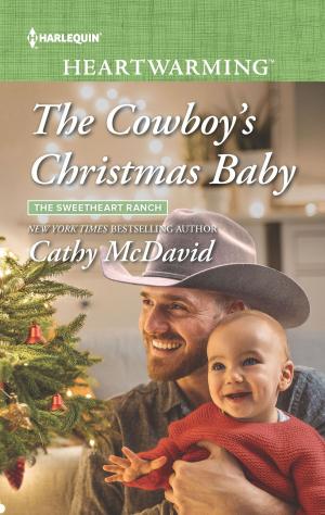Cover of the book The Cowboy's Christmas Baby by Lucy King